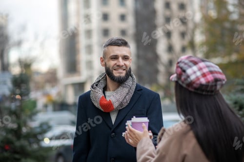 Preview: Joyful bearded man standing with his girlfriend