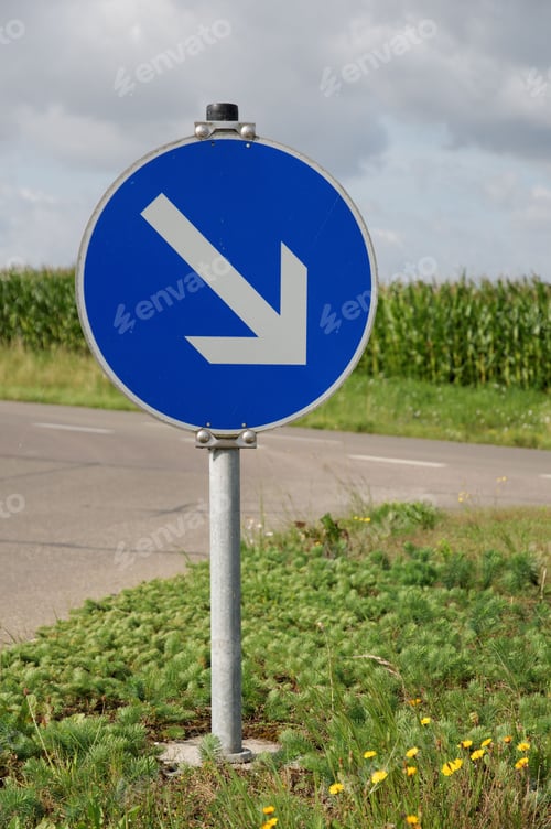 Preview: Blue and white road sign with an arrow pointing left, indicating a left turn