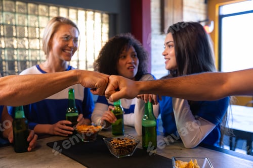 Preview: Supporters talking together in a bar