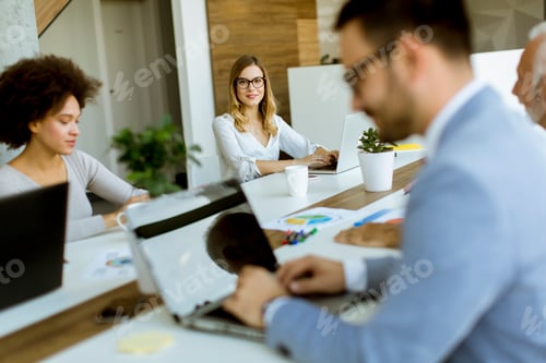 Preview: Business people working in modern office