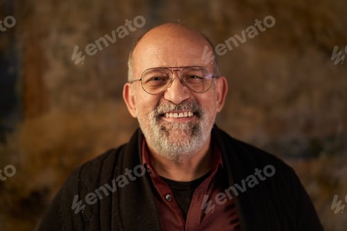 Preview: Portrait of a middle-aged Caucasian smiling man looking at camera. Look of an older person