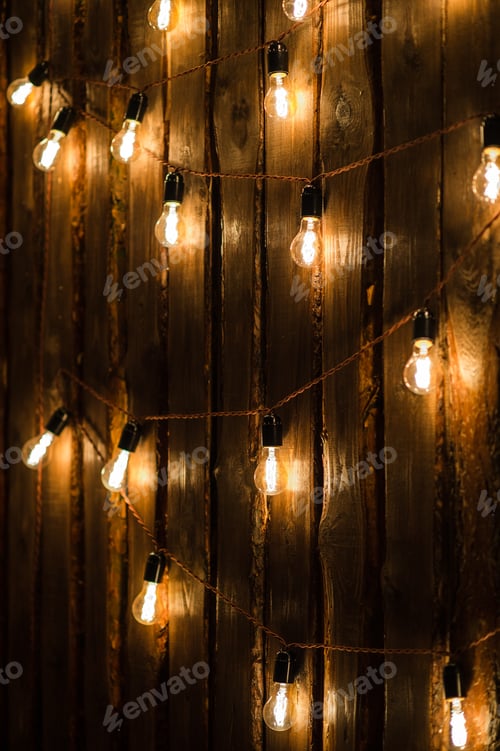 Preview: Designer light bulbs on dark wooden background
