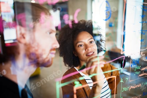 Preview: Businesspeople discussing together in conference room during meeting at office