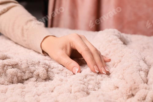 Preview: Woman touching soft knitted fabric, closeup view