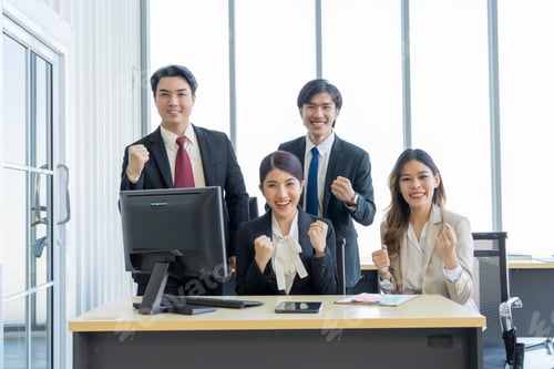 Preview: Successful Business Team Cheering in Modern Office