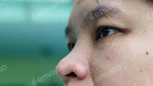 Preview: closeup sweating on face of asian women . Concept sport and Exercise