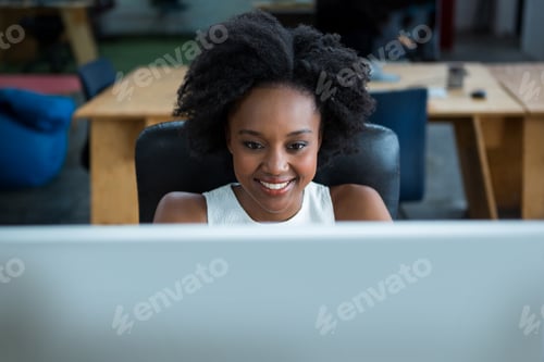 Preview: Female graphic designer using desktop pc