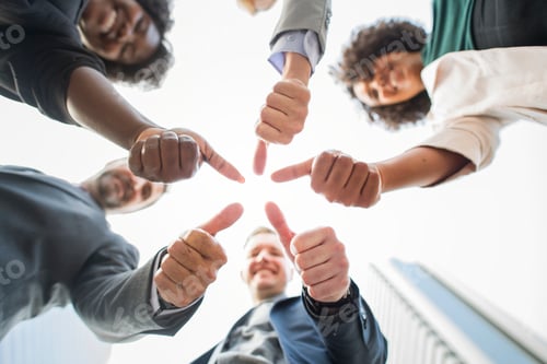 Preview: Business people giving a thumbs up