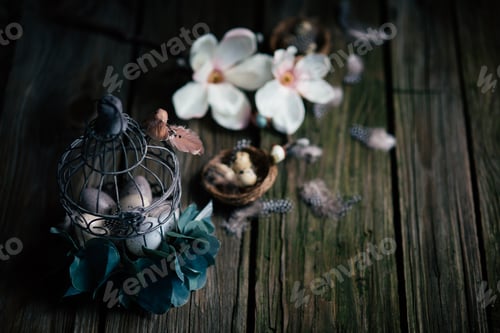 Preview: Beautidul Easter decorations of quail eggs and magnolie on wooden background