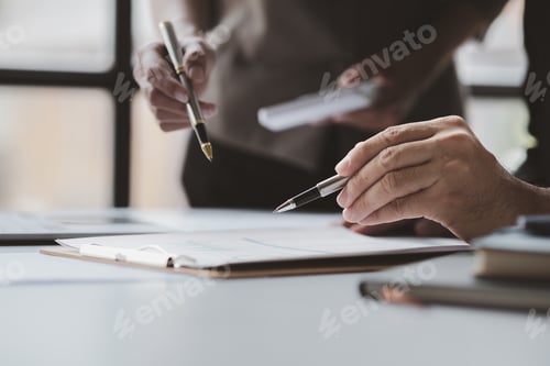 Preview: Businessman is reviewing monthly sales documents for analysis and marketing plans for more sales gro