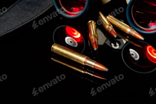 Preview: Military binoculars and cartridges on mirror background