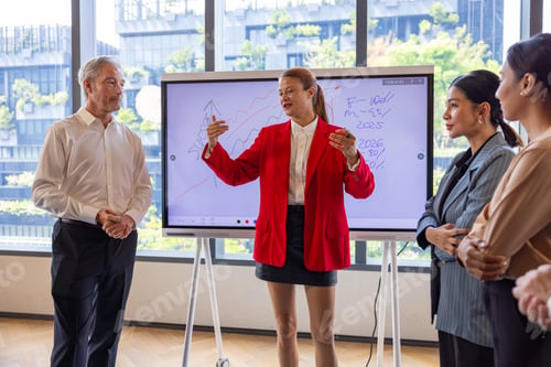 Preview: Businesswoman Presenting Strategy to Corporate Team