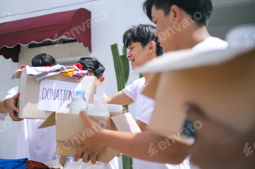 Preview: Group of People Working in Charitable Foundation, Separating and Listing Donation Stuffs