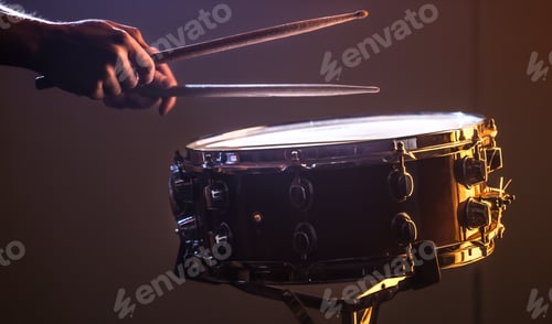 Preview: man playing the snare drum on a beautiful colored background
