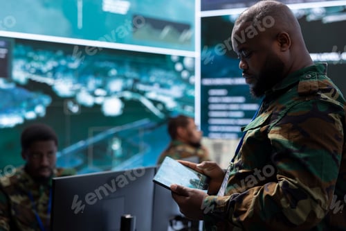 Preview: Government intelligence officer in control center managing surveillance activity