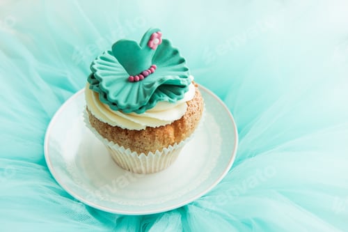 Preview: Decorative Cupcake with Icing Flower Topping on Plate