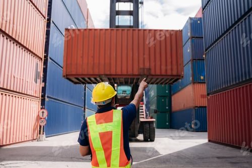 Preview: Engineer or Foreman checking inventory or task details at Container cargo harbor.