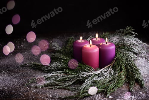 Preview: Christmas eve, wreath with four burning purple advent candles.