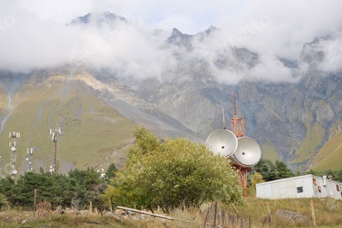 Preview: Telecommunications satellite dish radio telescope in mountains. Earth based astronomical locator