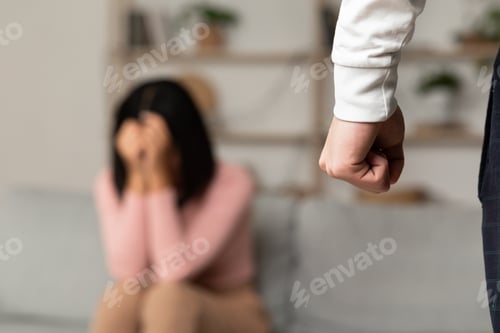 Preview: Domestic Abuse, Angry Asian Husband Clenching Fist Threatening Wife Indoors