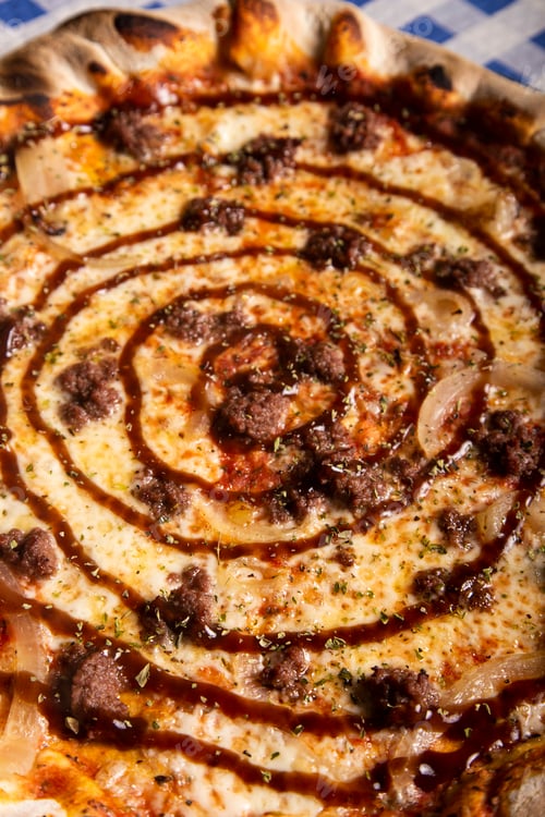 Preview: Homemade minced meat pizza with barbecue sauce. macro photography