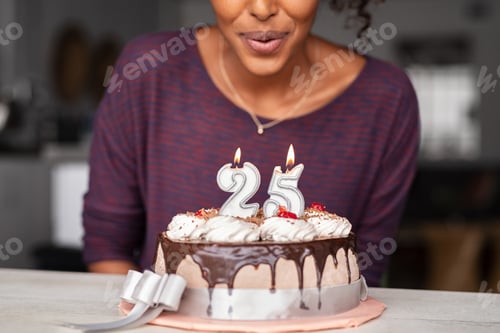 Preview: Woman Celebrating with Chocolate Birthday Cake and Candles