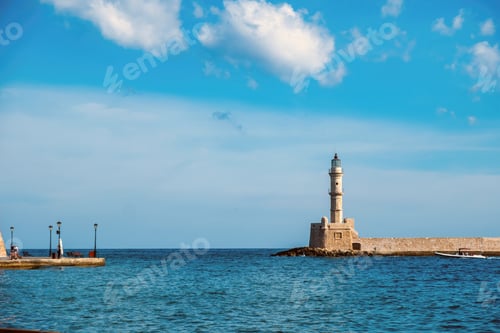 Preview: Crete Greece. Lighthouse, beacon at Venetian harbour in Old Town of Chania. Sunny day