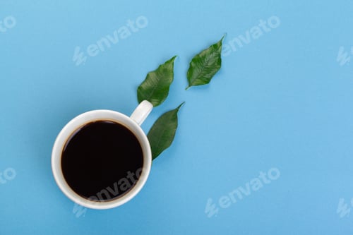 Preview: Cup of coffee on a blue table