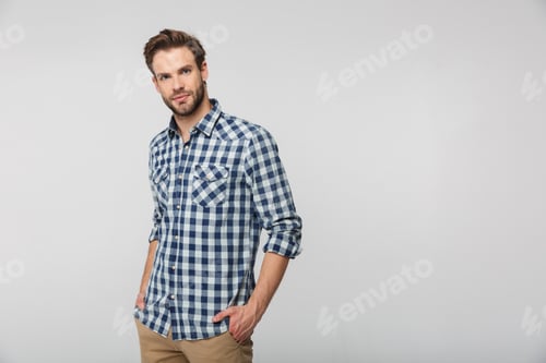 Preview: Man Poses with Plaid Shirt on White Background