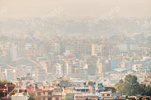 Preview: View of Kathmandu capital of Nepal from mountain through urban haze with lot of low rise buildings