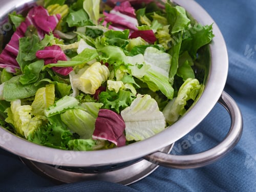 Preview: Romano, radicchio and frisee salads mixed in a bowl