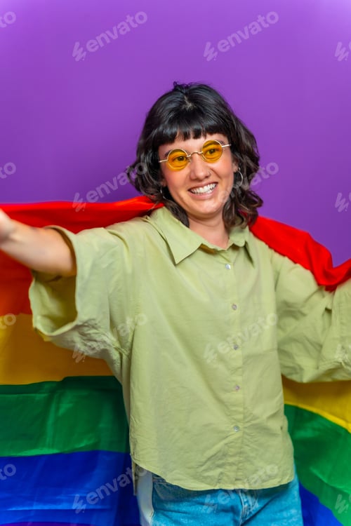 Preview: Non binary person raising lgbt rainbow flag