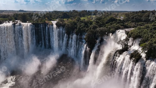 Preview: Kalandula Waterfall cascades magnificently in Angola under a clear sky