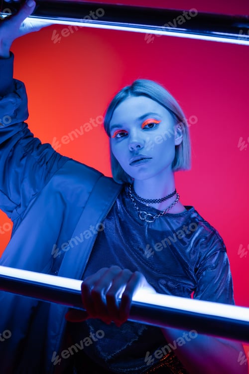 Preview: Young Woman with Creative Makeup Posing with Neon