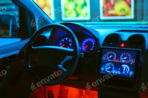 Preview: The interior of the modern car with a red backlight. evening night time