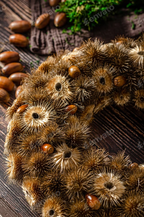 Preview: Natural Acorn Wreath on a Dark Wood Table