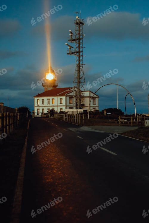 Preview: Road and lighthouse in evening
