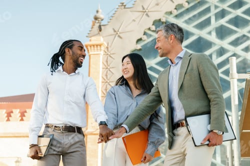 Preview: Happy business people outdoor, team spirit