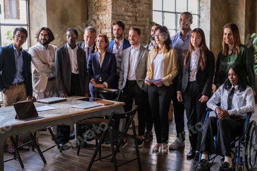 Preview: Group of multicultural business people from a coworking space standing together