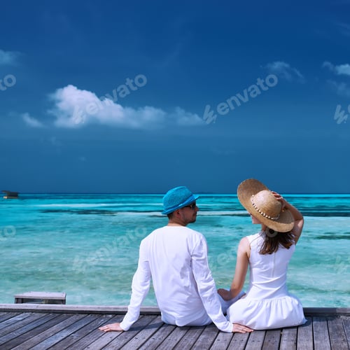 Preview: Couple On A Tropical Beach Jetty At Maldives
