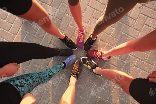 Preview: Legs of athletes in a circle