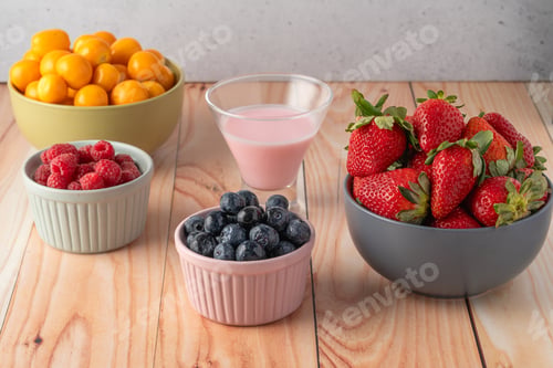 Preview: Wooden table with bowls with fruit and yogurt
