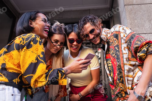 Preview: Stylish friends with smartphone on street