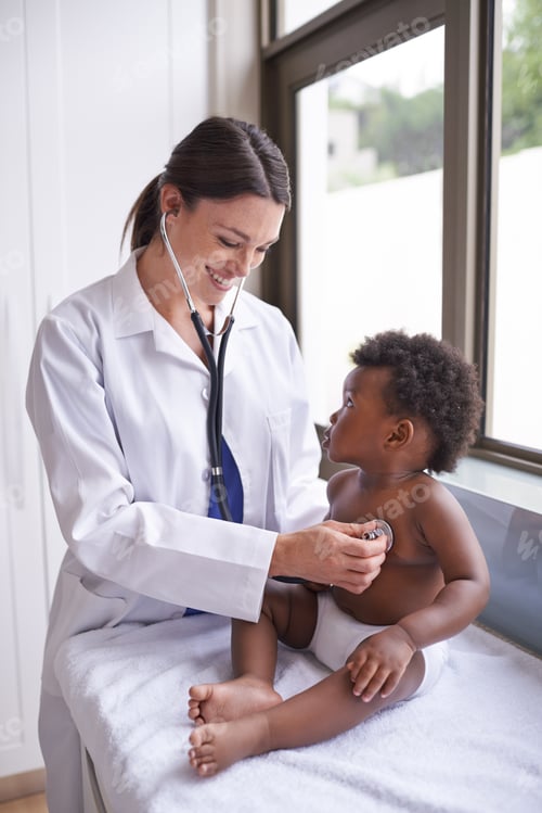 Preview: Having his very first checkup. A female doctor doing a checkup of a baby.