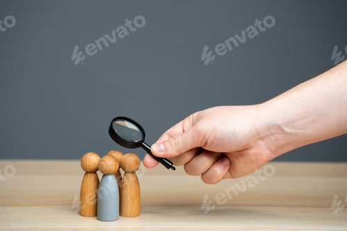 Preview: Businessman examines a team member.