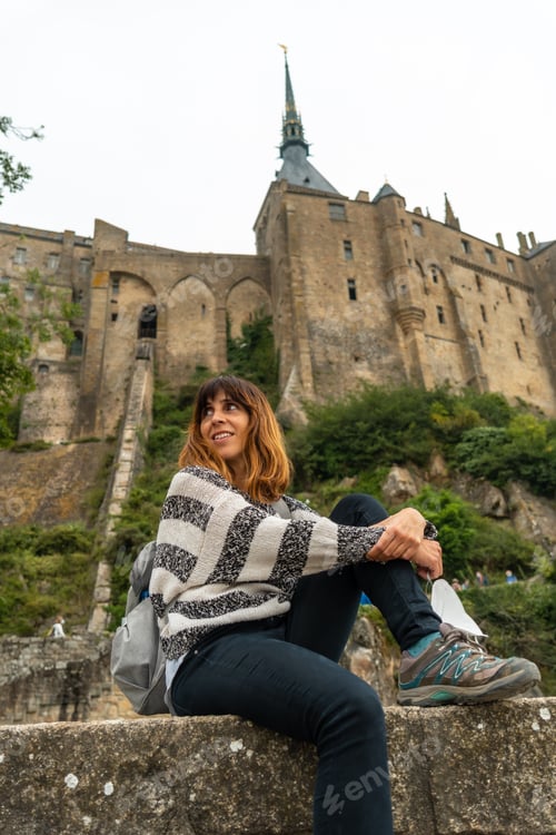 Preview: A young tourist visiting the famous Mont Saint-Michel Abbey, Normandy, France