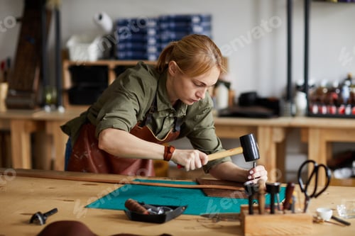 Preview: Female Craftsman Working in Shop