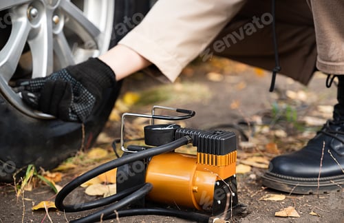 Preview: Man car inspection Measure quantity Inflated Rubber tires car.Close up hand holding machine Inflated