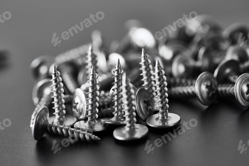 Preview: Stack of self-tapping screws, grey background