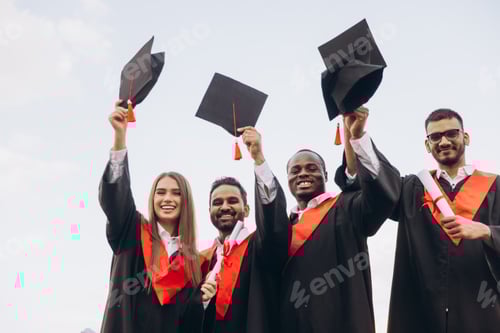 Preview: Joyful Graduates Celebrating Their Academic Achievement With Caps in the Air